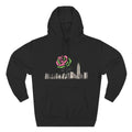 Black hoodie with graphic of a city skyline featuring a pink and green rose growing among buildings